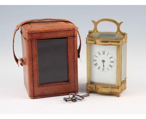 An early 20th Century brass unnamed carriage clock with original leather bodied carry case, one hand to clock detached.