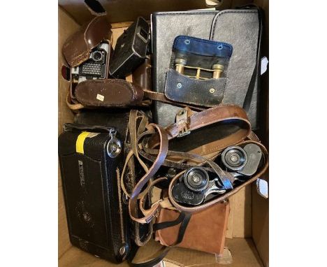 A collection of cameras to include a large bellows camera and WW1 binnocular