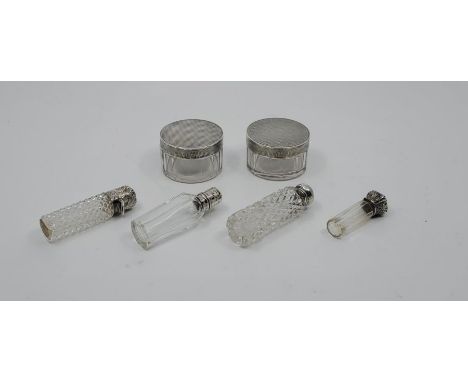 A pair of engine turned silver capped glass vanity jars, by F Burton Crosbee, Birmingham 1929, together with four various sma