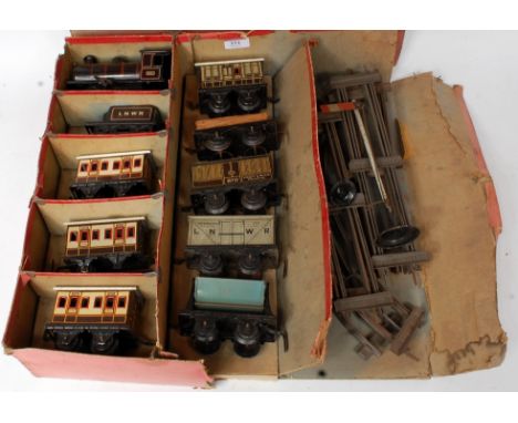 Bing LNWR boxed passenger set containing black 0-4-0 loco No. 2663 with fixed key and 4 wheel LNWR tender, 3x 1st/3rd coaches