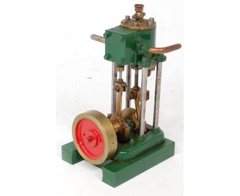 A well engineered single cylinder vertical steam engine, comprising single cylinder raised on pillars, with slip eccentric, u