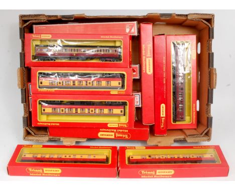 16 boxed Hornby and Lima coaches, including 4x Hornby crimson/cream BR Mk1, 3x Lima crimson/cream MK1, 4x Lima LMS maroon Mk1