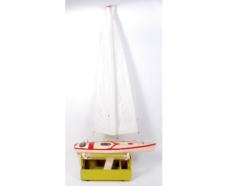 A radio controlled scale model of a Racing Yacht, to measure 35" in length and 76" in height from keel to sail, fitted with n