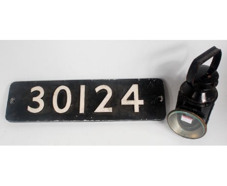 A reproduction locomotive number plate No.30124, sold with a BR Hand Lamp