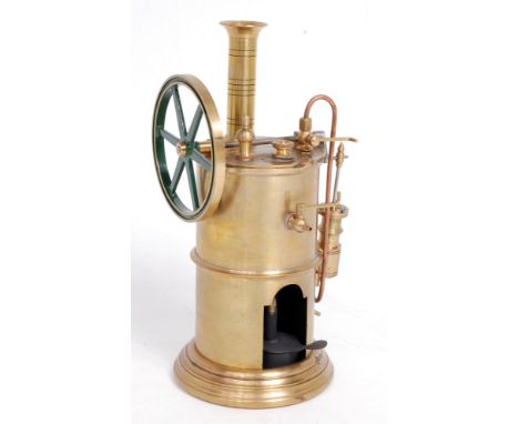 Freelance design spirit fired vertical steam engine, constructed from brass and copper components, comprising of single oscil