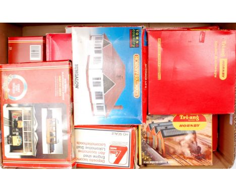 A Hornby R410 powered turntable, and a number of Hornby, Peco, Lima etc lineside buildings, including stations, engine sheds 