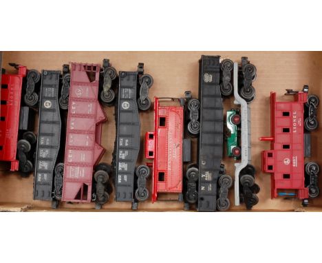 A large tray containing 8 Lionel American bogie wagons including SP caboose No. 2257, Pennsylvania coal with load No. 2452 'L