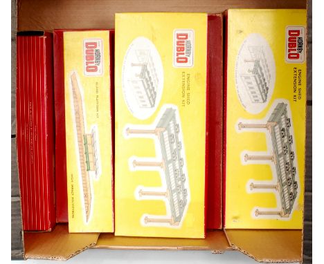 A Hornby Dublo 5005 2 road engine shed, and 3 additional 5006 2 road extension kits, one or two small parts missing, but gene