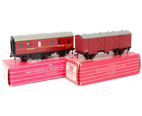 A Hornby Dublo 4076 six wheeled passenger brake van (stove) (G-VG,BG), and a 4305 WR passenger fruit van in BR maroon (G,BG)