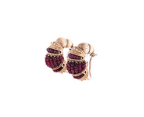 A PAIR OF RUBY EARRINGS each of semi-hoop design, comprised of sections of alternating rope and bead detailing and faceted ru