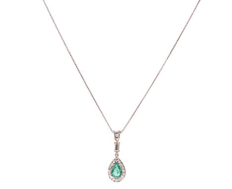 AN EMERALD AND DIAMOND PENDANT centred with an oval mixed-cut emerald weighing 1.46cts, within a surround of round brilliant-