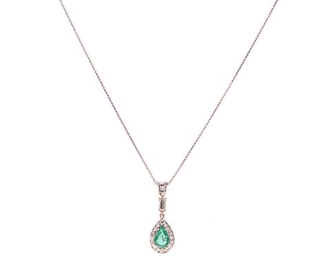 AN EMERALD AND DIAMOND PENDANT centred with an oval mixed-cut emerald weighing 1.46cts, within a surround of round brilliant-