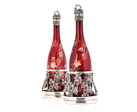 A SHEFFIELD PLATE-MOUNTED BOHEMIAN CRANBERRY GLASS DECANTER AND COASTER SET, 19TH CENTURY each tapering circular body pierced