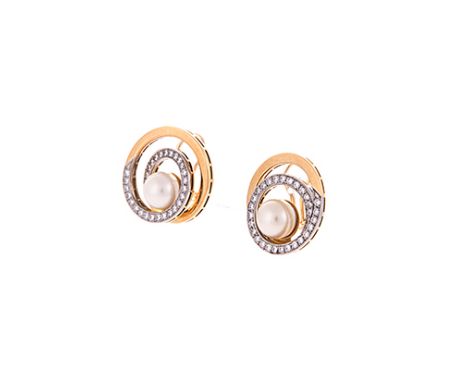 A PAIR OF PEARL AND DIAMOND EAR CLIPS each mounted with a Japanese marine pearl, within a two tone plain and diamond-set spir