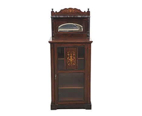 AN EDWARDIAN ROSEWOOD AND INLAID MUSIC CABINET the rectangular top surmounted by an arched and bevelled mirror beneath a shel