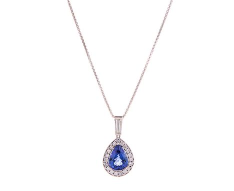 A TANZANITE AND DIAMOND PENDANT NECKLACE claw set to the centre with a pear-shaped tanzanite weighing 3.61cts enclosed within