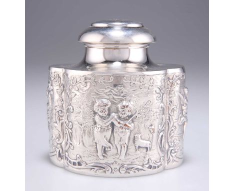 A LATE VICTORIAN SILVER-PLATED TEA CADDY shaped oval, chased with children, lamb, dog and musical putti, monogrammed to the c