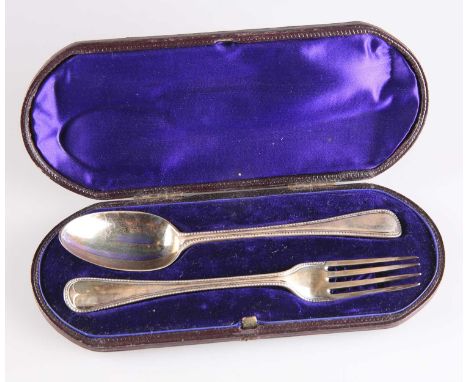 A VICTORIAN SILVER CHRISTENING FORK AND SPOON by George William Adams, London 1881, bead pattern, cased. Fork 15.5cm long, 2 