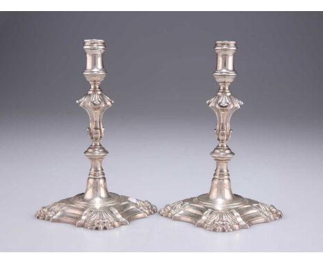 A PAIR OF GEORGE II CAST SILVER TAPERSTICKS maker H M, London 1758, each with knopped stem and shaped square base. (2) 12.5cm