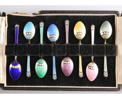 A SET OF EIGHT ELIZABETH II SILVER-GILT AND ENAMEL COFFEE SPOONS by Turner &amp; Simpson Ltd, Birmingham 1959, each picked-ou