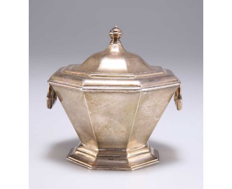 A GEORGE V SILVER CADDY by S W Smith &amp; Co, Birmingham 1912, octagonal, with hinged handles and domed hinged cover. 9cm hi