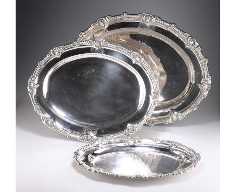 AN IMPORTANT GRADUATED SET OF THREE GEORGE III SILVER MEAT DISHES by Paul Storr, London 1811, shaped oval, with heavily gadro