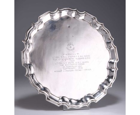 † AN INDIAN SILVER SALVER by Hamilton &amp; Co, Calcutta (probably), shaped circular with a moulded everted rim, with present