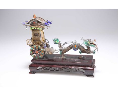 A LATE 19TH CENTURY CHINESE FILIGREE SILVER AND ENAMEL MODEL OF A DRAGON PULLING A CARRIAGE unmarked, picked out in coloured 