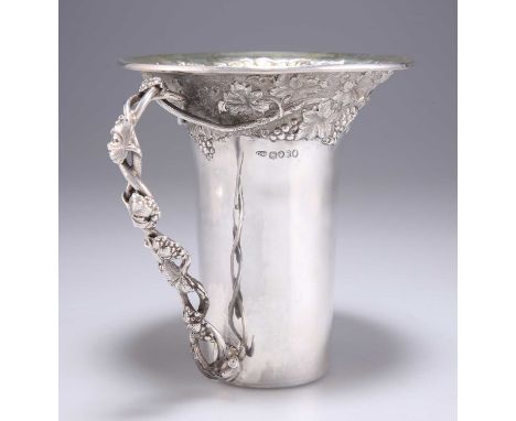 A LARGE WILLIAM IV SILVER MUG by Charles Gordon, London 1837, trumpet-shaped, chased with a vine pattern, open-work vine-form