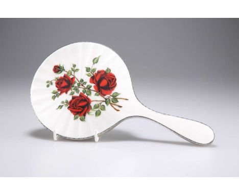 AN ELIZABETH II SILVER AND ENAMEL HAND-MIRROR maker T.P, London 1959, decorated with roses. 25.5cm longThe marks are clear. O