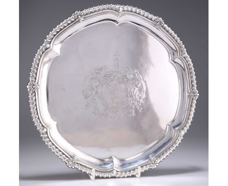 A GEORGE III SILVER SALVER by Paul Storr, London 1815, circular, the moulded rim with shells and gadrooning, engraved to the 