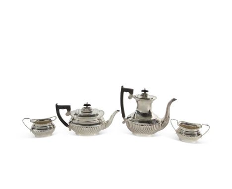An Elizabeth II silver tea/coffee service comprising coffee pot, teapot, sugar bowl and cream jug of oval form, applied gadro