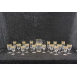 A suite of Baccarat 'Eldorado" drinking glasses, mid 20th century decorated in relief with a gilt