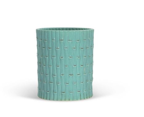 A Chinese ceramic brush pot with a bamboo design and green glaze with seal mark to base, 14cm high