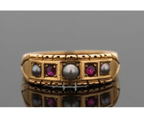 A late 19th century Etruscan style ruby and pearl ring, the alternating pearls and rubies with V-shape decoration to shoulder