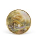 A Royal Worcester cabinet plate painted with a forest scene with bluebells, indistinctly signed