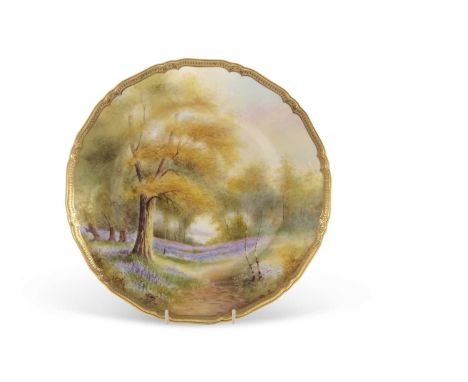 A Royal Worcester cabinet plate painted with a forest scene with bluebells, indistinctly signed lower right, 27cm diameter