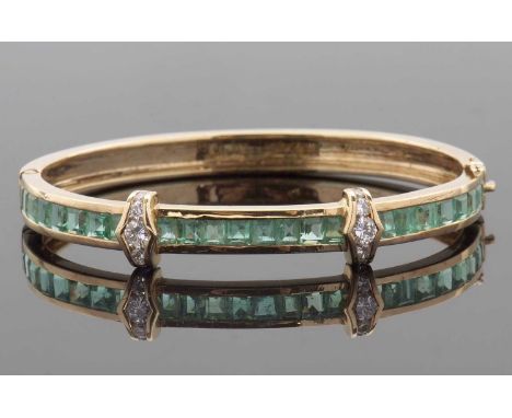 An emerald and diamond bangle, the upper half of the hinged bangle with channel set square step cut emeralds, with two bars o