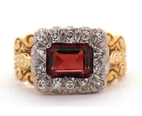 A 19th century 18ct garnet and diamond ring, the rectangular garnet surrounded by single cut diamonds, head approx. 10.5 x 12