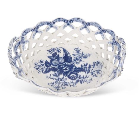 A fine 18th Century Worcester porcelain basket with blue printed pine cone design and painted borders with rope handles, 27cm