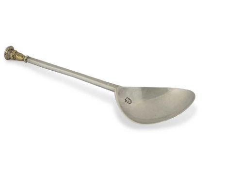 A James I  silver seal top spoon having a fig shaped bowl to a tapering hexagonal shaft, the shaped baluster gilt finial init