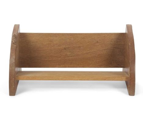 Robert Mouseman Thompson, a light oak bookstand with quarter circle ends and carved mouse decoration, 45cm wide