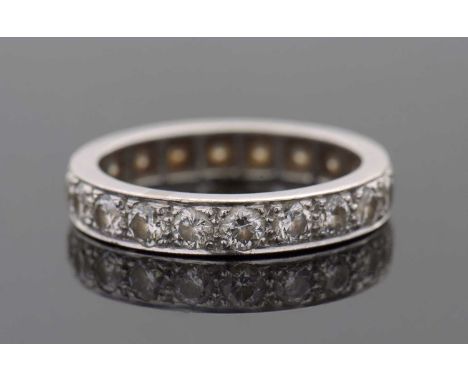 A diamond eternity ring, set throughouyt with round brilliant cut diamonds, total estimated approx. 1.20cts, all set in unmar