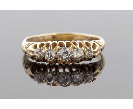 An arly 20th century 18ct diamond ring, the five slightly graudated five old mine cut diamonds, total estimated approx. 0.44c