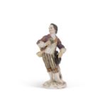 A Meissen figure of a gallant holding a posie of flowers, late 19th/20th Century, cross swords