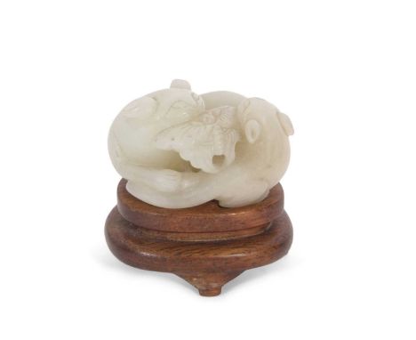A jade carving of two cats and a butterfly, on wooden base, late Qing Dynasty