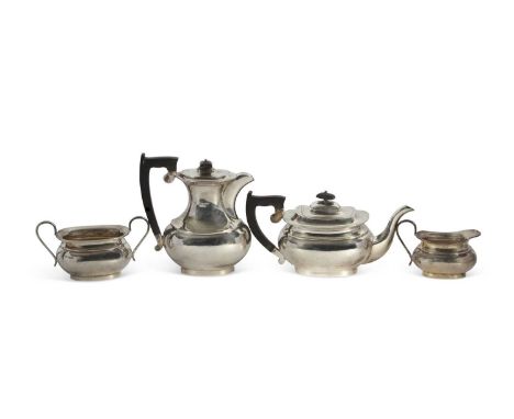 George VI silver four piece tea service comprising a coffee pot, teapot, sugar bowl and cream jug of plain oval form, Sheffie
