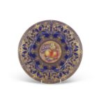 A Royal Worcester cabinet plate, the blue ground with tooled gilt decoration, the central panel