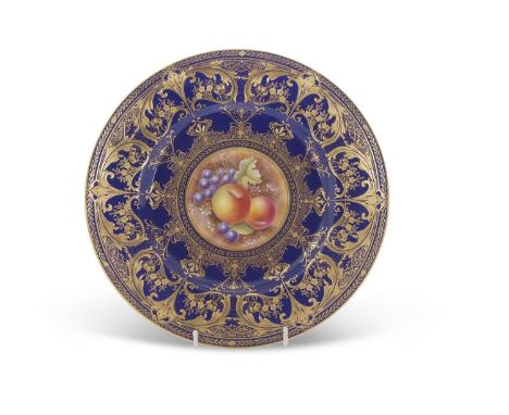 A Royal Worcester cabinet plate, the blue ground with tooled gilt decoration, the central panel painted with fruit, signed by