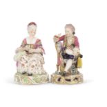 A pair of Derby figures both seated on chairs on pierced circular bases, 19th Century, one of a